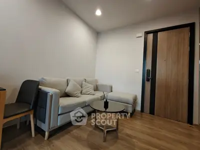 Modern living room with cozy sofa and wooden flooring