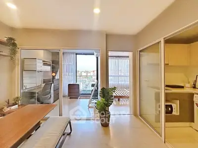 Modern apartment interior with open layout and balcony view