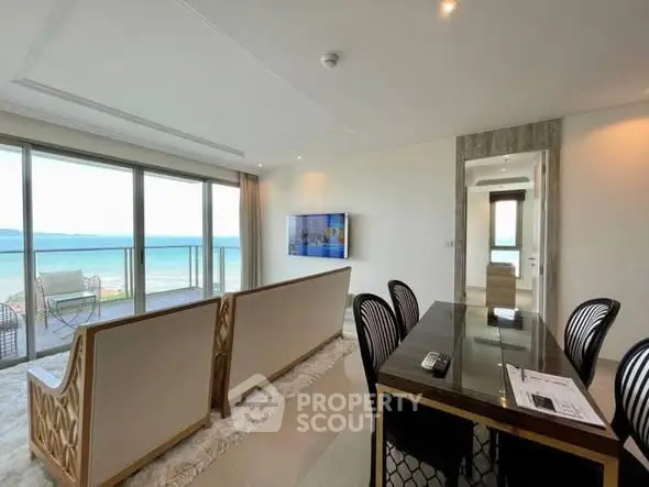 Luxurious living room with ocean view and elegant dining area