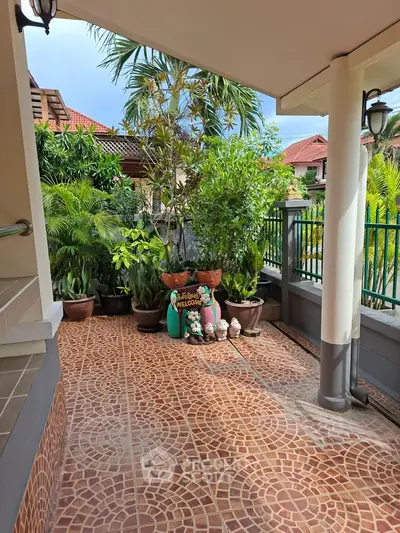Charming garden entrance with lush greenery and welcoming decor