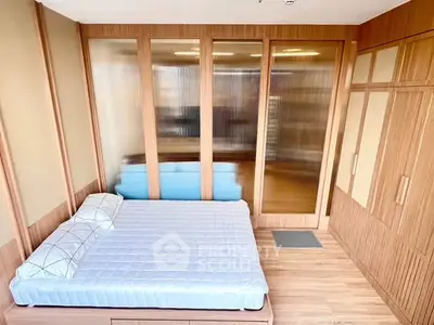 Modern bedroom with wooden accents and large wardrobe