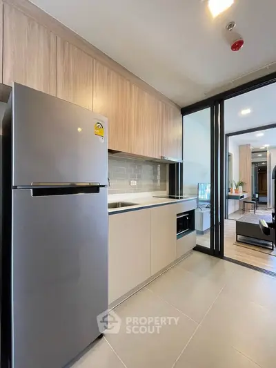 Modern kitchen with sleek appliances and open layout in a stylish apartment