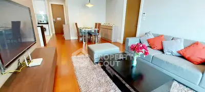 Modern living room with stylish decor and open dining area