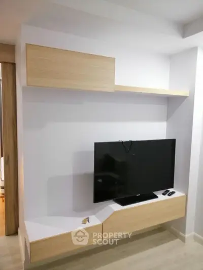 Modern living room with sleek TV unit and minimalist design