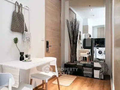 Stylish modern apartment interior with dining area and laundry appliances