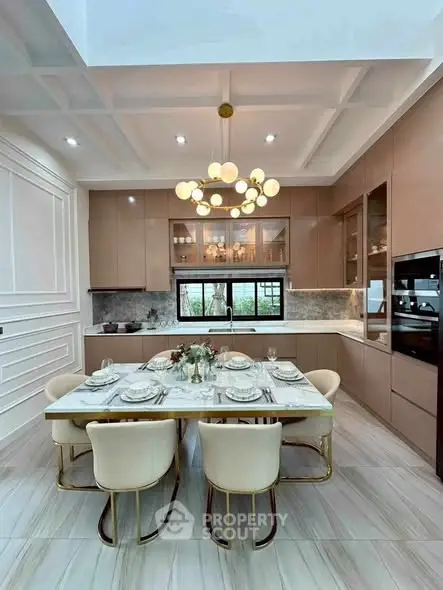 Luxurious modern kitchen with elegant dining setup and stylish lighting.