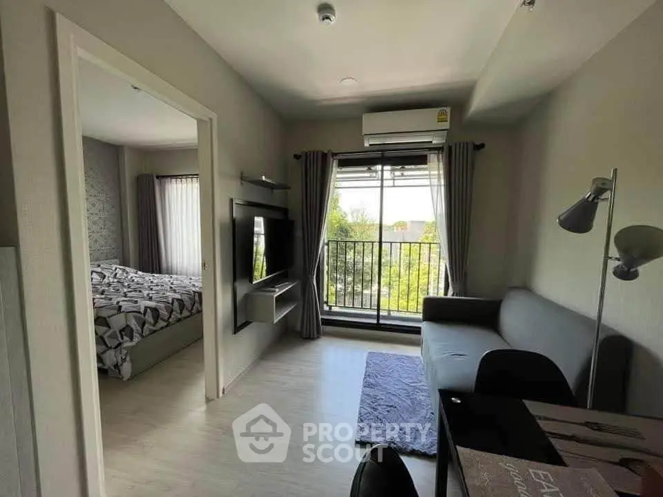 Modern living room with balcony view and cozy bedroom in stylish apartment.