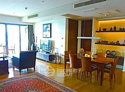Spacious living and dining area with elegant decor and natural light.