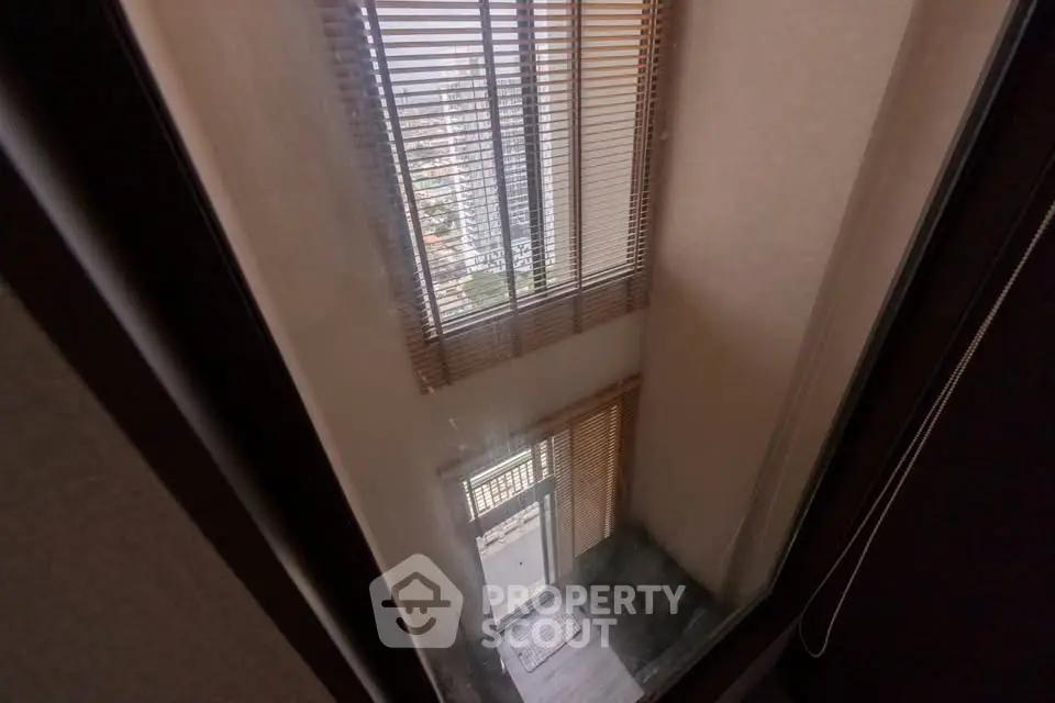 Stunning view from a high-rise building window showcasing urban landscape.