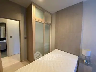 Modern bedroom with built-in wardrobe and minimalist decor