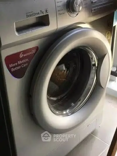 Modern washing machine with advanced features in a stylish laundry room.