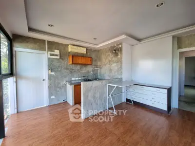 Modern kitchen with open layout and sleek design in a bright apartment