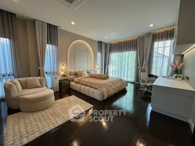 Luxurious modern bedroom with elegant decor and ample natural light