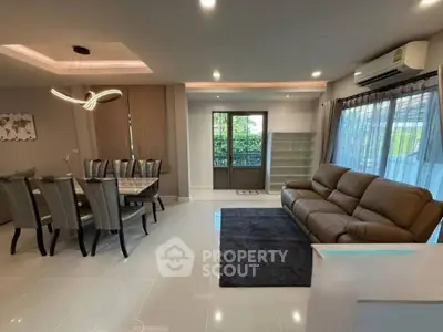 Modern living room with elegant dining area and stylish lighting