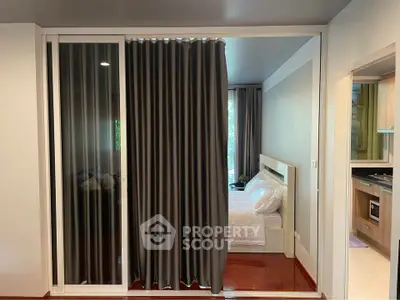 Modern bedroom with sliding glass doors and elegant curtains