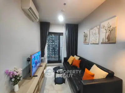 Modern living room with stylish decor and balcony view