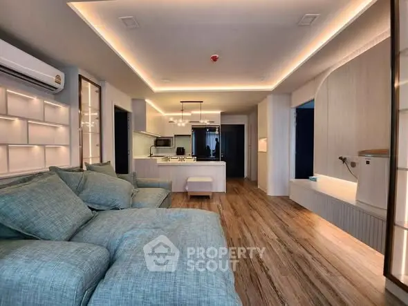 Luxurious modern living room with open kitchen and stylish lighting