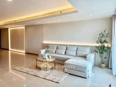 Spacious modern living room with elegant sofa and stylish decor