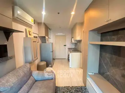 Modern compact living room with integrated kitchen and stylish decor