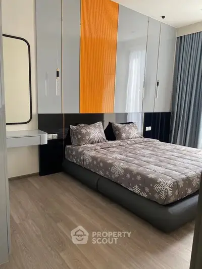Modern bedroom with stylish decor and ample storage space