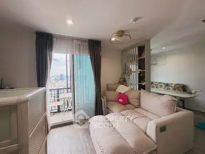 Cozy living room with plush sofa and city view balcony in modern apartment