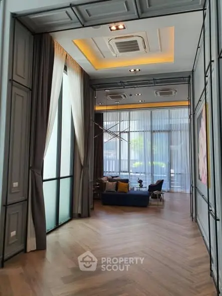 Luxurious modern living room with high ceilings and elegant decor