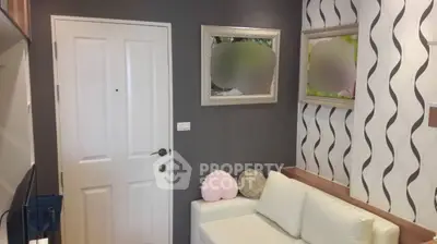 Chic modern living room with stylish wallpaper and cozy white sofa