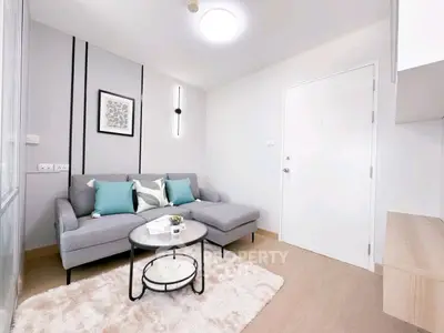 Modern living room with stylish gray sofa and chic decor