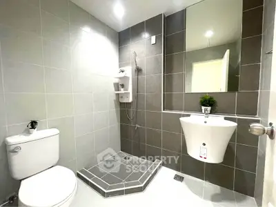 Modern bathroom with sleek tiles and contemporary fixtures