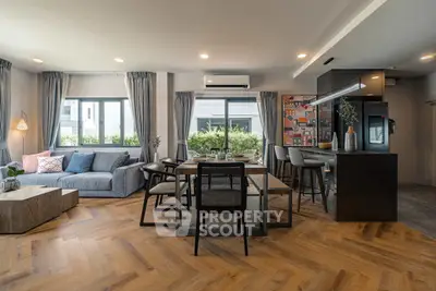 Spacious modern living room with open kitchen and stylish decor