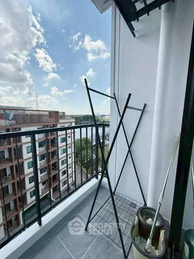Charming balcony with city view, perfect for relaxation and enjoying the skyline.
