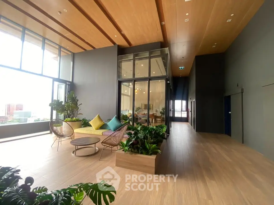 Spacious modern living area with large windows and stylish decor