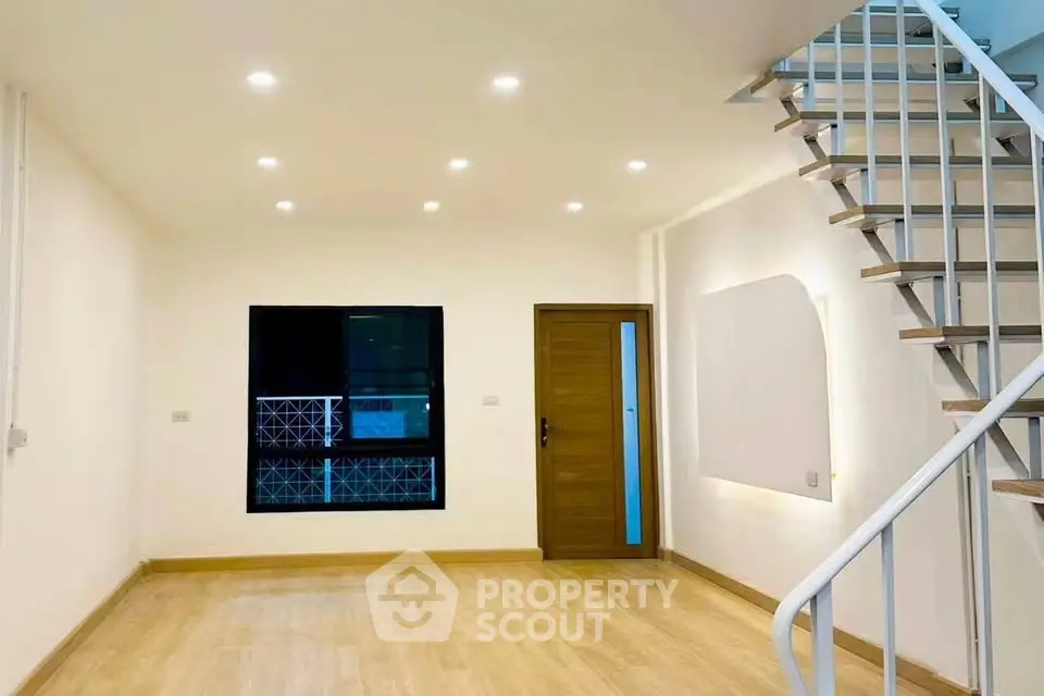Modern duplex interior with wooden flooring and stylish staircase