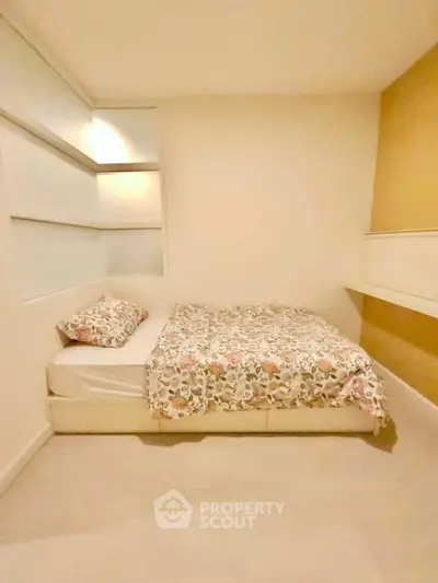 Cozy bedroom with modern design and floral bedding