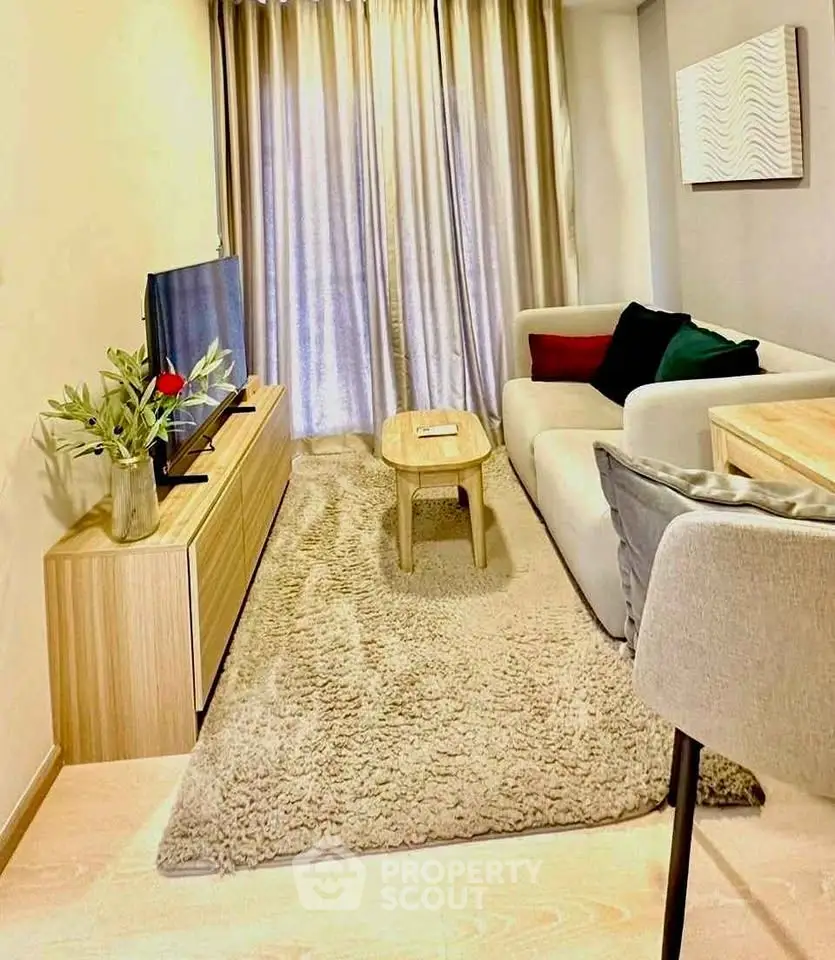 Cozy modern living room with plush rug and stylish furniture, perfect for relaxation.