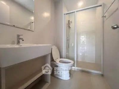 Modern bathroom with sleek shower and elegant fixtures