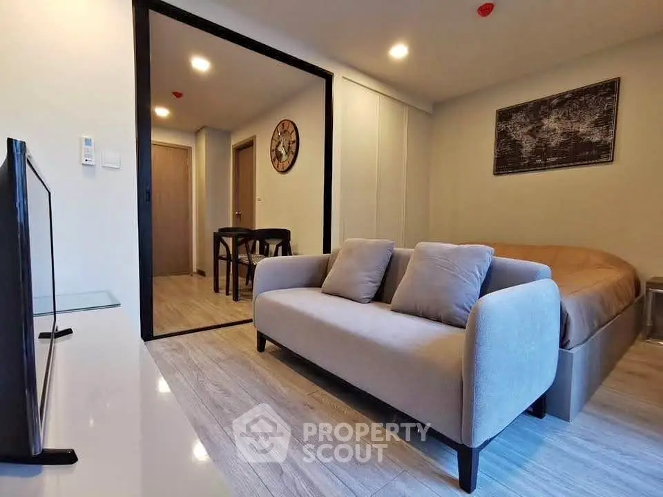 Modern studio apartment with cozy living area and stylish decor