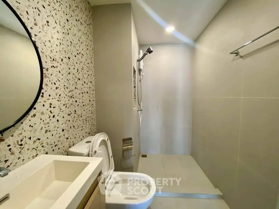 Modern bathroom with sleek design and terrazzo accent wall