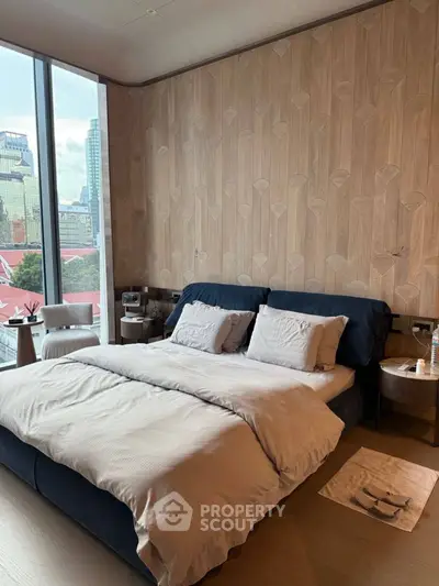 Luxurious bedroom with city view and stylish decor