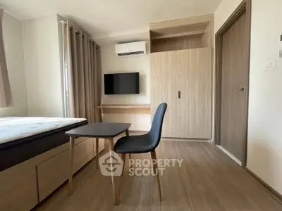 Modern minimalist bedroom with wooden furniture and wall-mounted TV