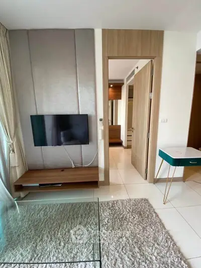 Modern living room with wall-mounted TV and stylish decor