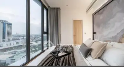 Luxurious bedroom with stunning city view and elegant decor