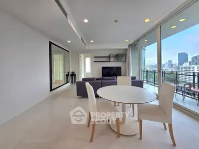 Spacious modern living room with city view and large balcony access