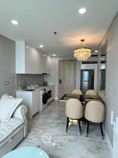 Luxurious open-plan living room with modern kitchen and elegant dining area