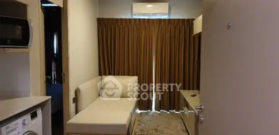Cozy living room with modern sofa and air conditioning in a stylish apartment.
