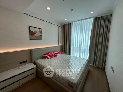 Modern bedroom with stylish decor and natural light