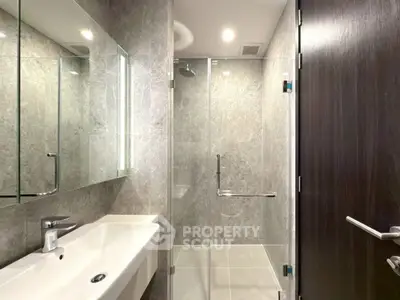 Modern bathroom with sleek design and glass shower enclosure