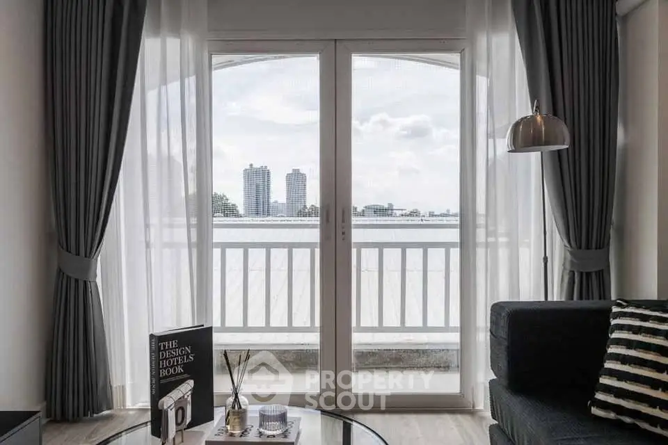 Stylish living room with balcony view and modern decor in urban apartment
