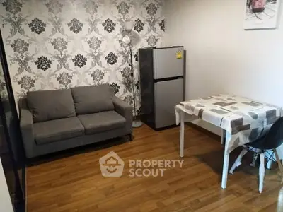 Cozy living room with modern decor and compact dining area