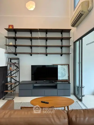 Modern living room with sleek shelving and stylish furniture